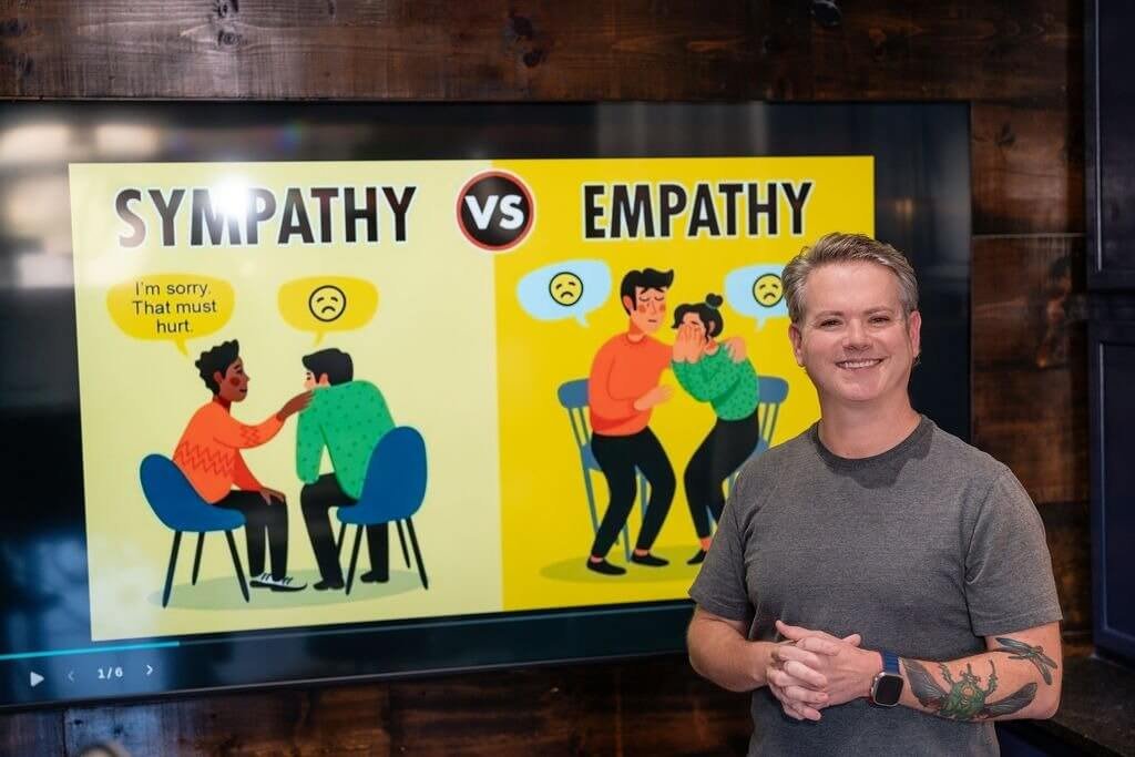 Life coach Ben explaining the difference between sympathy and empathy during a personal development coaching session.